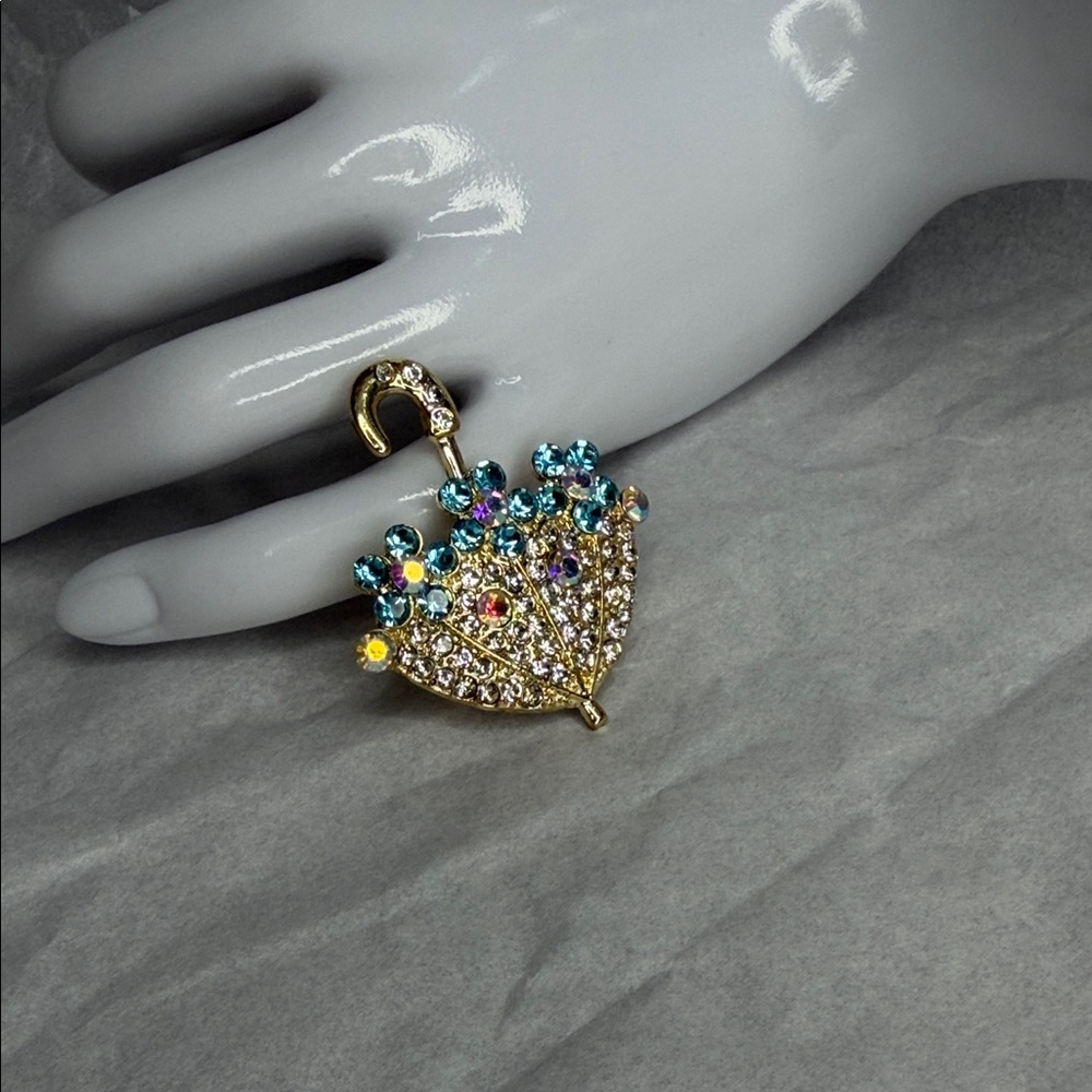 Elegant Gold and Blue Gemstone Umbrella Brooch